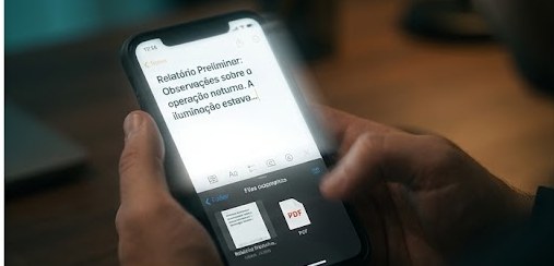 Recriação: a tela do iPhone capturada, com um arquivo PDF da nota surgindo automaticamente.